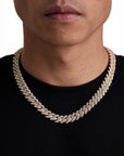 Model wearing 13mm 18K gold ice prong cuban necklace by Iceman Society, front view