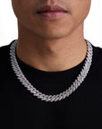 Model wearing 13mm white gold ice prong cuban necklace by Iceman Society, front view