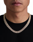 Model wearing 13mm 18K gold ice prong cuban chain set by Iceman Society, front view
