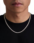 Model wearing 4mm 18K gold ice sparkler tennis chain set by Iceman Society, front view