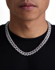 Model wearing 12mm white gold iceman cuban chain set by Iceman Society, front view