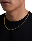 Model wearing 3mm 18k gold plain cuban necklace by Iceman Society, side view