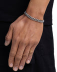 Model wearing 8mm white gold plain cuban bracelet by Iceman Society