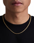 Model wearing 4mm 18k gold rope chain set by Iceman Society, front view