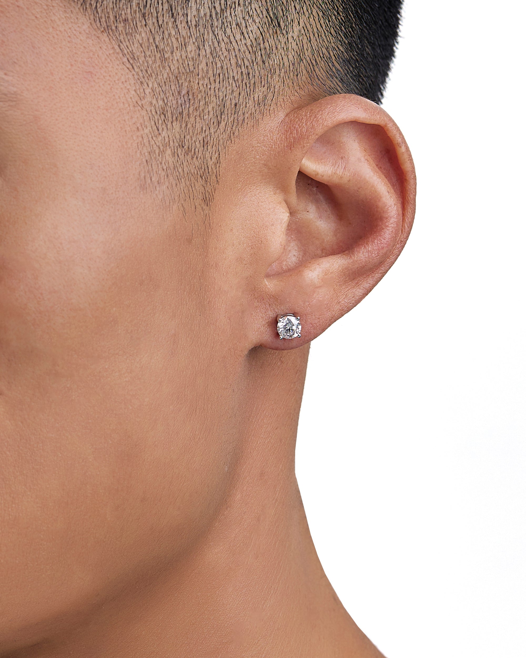 Model wearing white gold moissanite earrings by Iceman Society