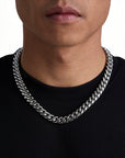 Model wearing 12mm white gold plain cuban necklace by Iceman Society