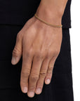 Model wearing 3mm 18k gold plain cuban bracelet by Iceman Society