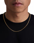 Model wearing 3mm 18k gold plain cuban necklace by Iceman Society