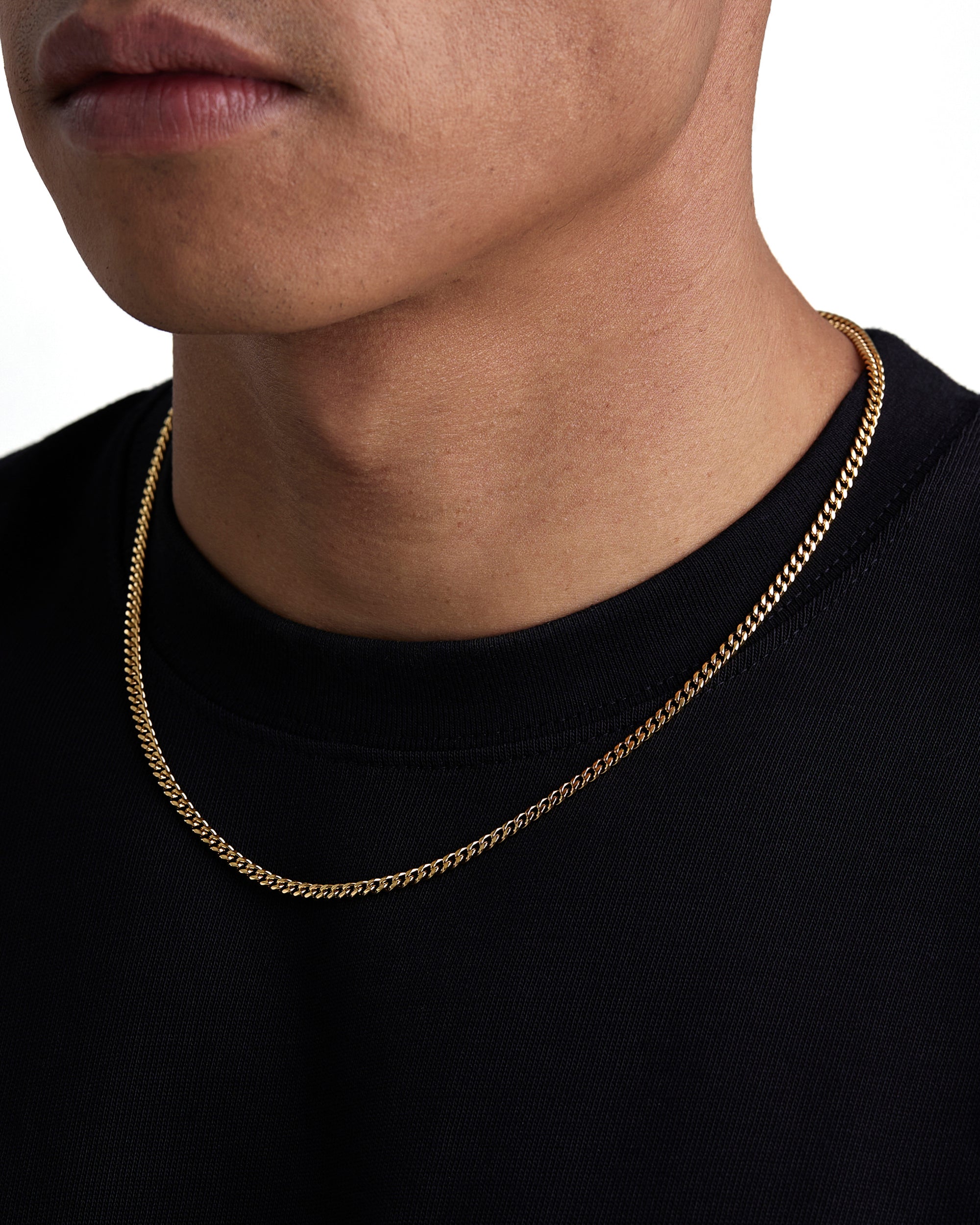 Model wearing 3mm 18k gold plain cuban necklace by Iceman Society, side view