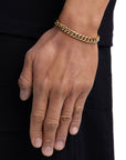 Model wearing 8mm 18k gold plain cuban bracelet by Iceman Society